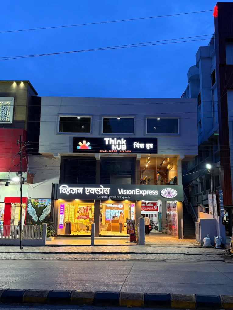 Modern office building exterior — Think Hub Cowork signage